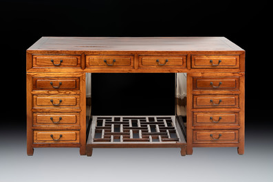 A Chinese wooden desk with drawers and a footrest, 19/20th C.