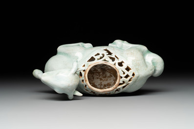 A pair of Chinese polychrome lions and a celadon-glazed goat, 20th C.