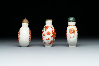 A diverse group of 12 Chinese snuff bottles and three covered seal paste boxes, Qianlong and Daoguang marks, 19th C.