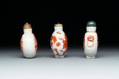A diverse group of 12 Chinese snuff bottles and three covered seal paste boxes, Qianlong and Daoguang marks, 19th C.