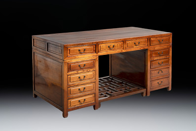 A Chinese wooden desk with drawers and a footrest, 19/20th C.