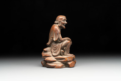 A Chinese bamboo figure of Luohan, a ruyi group on wooden stand and a hongmu stand, 19/20th C.