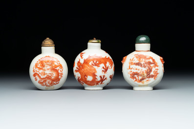 A diverse group of 12 Chinese snuff bottles and three covered seal paste boxes, Qianlong and Daoguang marks, 19th C.