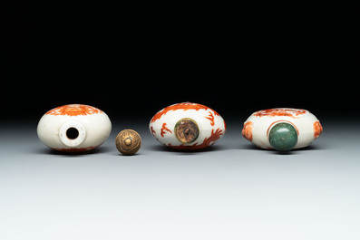 A diverse group of 12 Chinese snuff bottles and three covered seal paste boxes, Qianlong and Daoguang marks, 19th C.