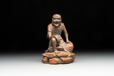 A Chinese bamboo figure of Luohan, a ruyi group on wooden stand and a hongmu stand, 19/20th C.