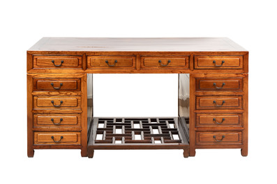 A Chinese wooden desk with drawers and a footrest, 19/20th C.