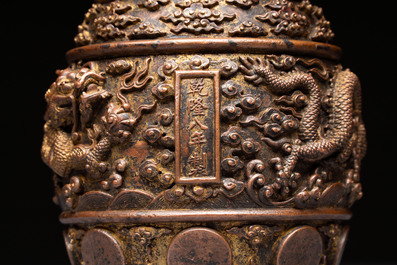A fine Chinese gilt-bronze 'dragon among clouds' bell, Qianlong mark and of the period, dated 1743