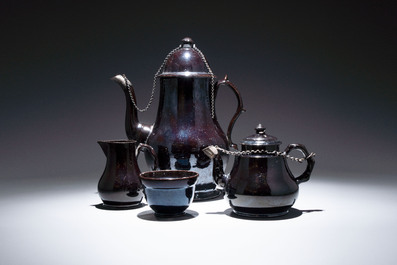 A black-glazed pottery coffeepot, teapot, milk jug and a bowl, Namur, 18th C.