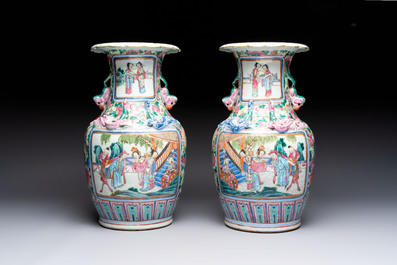 A pair of Chinese famille rose vases with narrative design on wooden stands, 19th C.