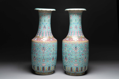 A pair of large Chinese famille rose turquoise-ground 'Buddhist symbols and lotus scroll' vases, Guangxu mark and of the period