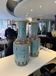 A pair of large Chinese famille rose turquoise-ground 'Buddhist symbols and lotus scroll' vases, Guangxu mark and of the period