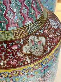 A pair of large Chinese famille rose turquoise-ground 'Buddhist symbols and lotus scroll' vases, Guangxu mark and of the period