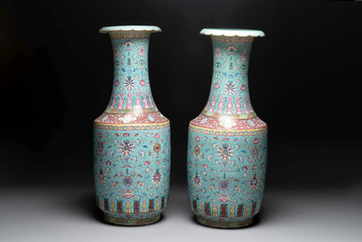 A pair of large Chinese famille rose turquoise-ground 'Buddhist symbols and lotus scroll' vases, Guangxu mark and of the period