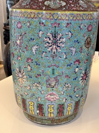 A pair of large Chinese famille rose turquoise-ground 'Buddhist symbols and lotus scroll' vases, Guangxu mark and of the period
