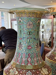A pair of large Chinese famille rose turquoise-ground 'Buddhist symbols and lotus scroll' vases, Guangxu mark and of the period