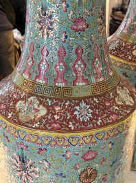 A pair of large Chinese famille rose turquoise-ground 'Buddhist symbols and lotus scroll' vases, Guangxu mark and of the period