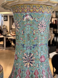 A pair of large Chinese famille rose turquoise-ground 'Buddhist symbols and lotus scroll' vases, Guangxu mark and of the period