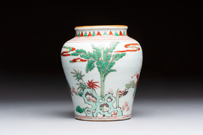 A small Chinese wucai jar with figures in a landscape, Transitional period
