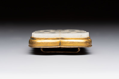 A Chinese gilt bronze-mounted white jade 'double happiness' belt buckle, 18th C.
