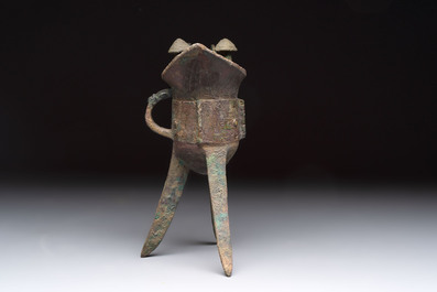 A Chinese archaic bronze wine vessel with taotie design, 'jue 爵', Zhou