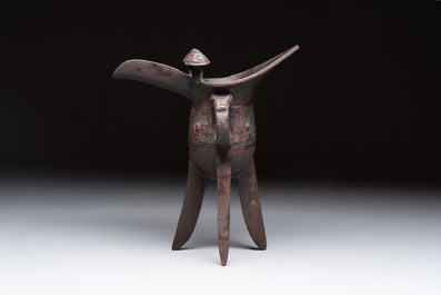 A Chinese archaic bronze wine vessel with taotie design, 'jue 爵', Zhou