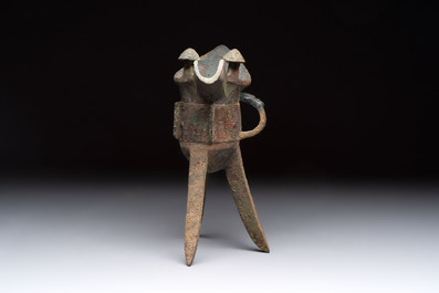 A Chinese archaic bronze wine vessel with taotie design, 'jue 爵', Zhou