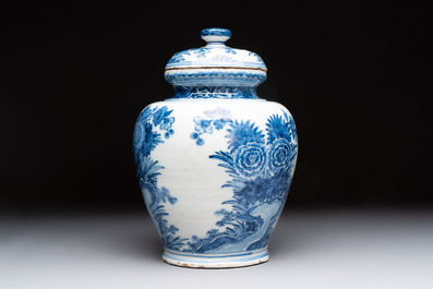 A blue and white Dutch Delft vase and cover with floral design, early 18th C.