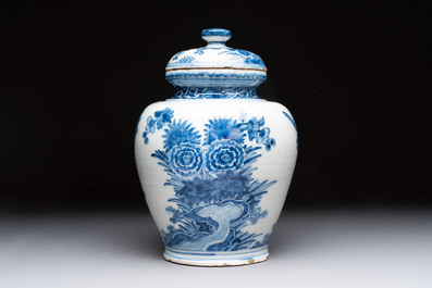 A blue and white Dutch Delft vase and cover with floral design, early 18th C.