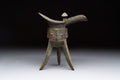 A Chinese archaic bronze wine vessel with taotie design, 'jue 爵', Zhou