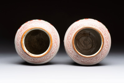 A pair of small Chinese wucai jars with sages in a landscape, Transitional period