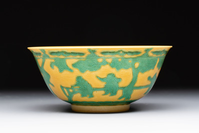 An imperial Chinese green-enamelled yellow-ground 'playing boys' bowl, Yongzheng mark and of the period