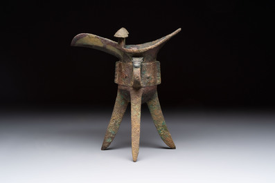 A Chinese archaic bronze wine vessel with taotie design, 'jue 爵', Zhou