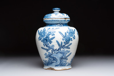 A blue and white Dutch Delft vase and cover with floral design, early 18th C.