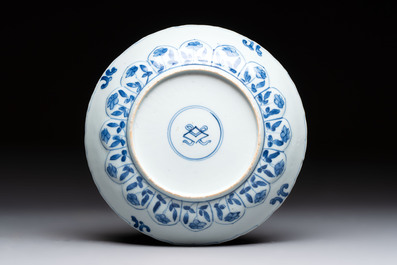A Chinese blue and white octagonal vase and a plate with floral design, Kangxi