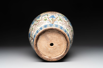A Qajar polychrome pottery 'flower scroll' vase, Iran, 19th C.