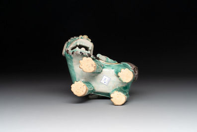 A Chinese verte biscuit 'Sogdian riding a Buddhist lion' group, 19th C.