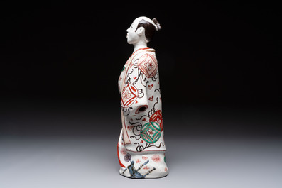A Japanese Arita Imari figure of a samurai dressed in a kimono, Edo, 17/18th C.