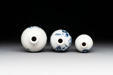 Three Chinese blue, white and copper-red snuff bottles with figural design, Yongzheng and Qianlong mark, 19th C.