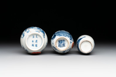 Three Chinese blue, white and copper-red snuff bottles with figural design, Yongzheng and Qianlong mark, 19th C.