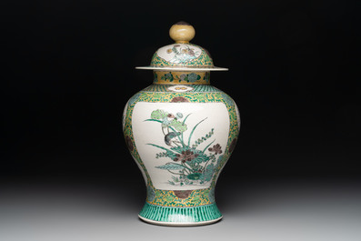A pair of Chinese verte-biscuit 'cranes and flowers' vases and covers, 19th C.