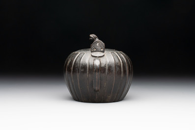 A Chinese bronze teapot and cover with a lion-shaped finial, Yuan