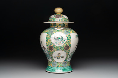 A pair of Chinese verte-biscuit 'cranes and flowers' vases and covers, 19th C.