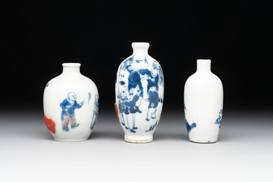 Three Chinese blue, white and copper-red snuff bottles with figural design, Yongzheng and Qianlong mark, 19th C.