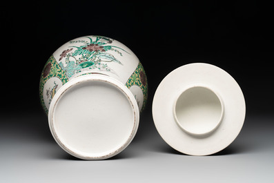 A pair of Chinese verte-biscuit 'cranes and flowers' vases and covers, 19th C.