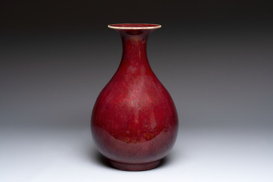 A large Chinese flamb&eacute;-glazed 'yuhuchunping' vase on a wooden stand, 19th C.
