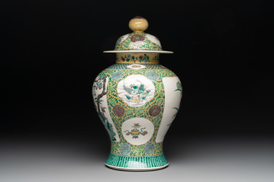 A pair of Chinese verte-biscuit 'cranes and flowers' vases and covers, 19th C.