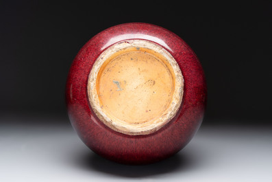 A large Chinese flamb&eacute;-glazed 'yuhuchunping' vase on a wooden stand, 19th C.
