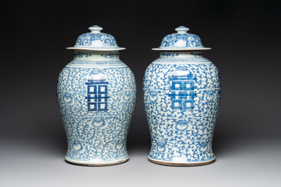 Two Chinese blue and white 'double happiness' covered vases and two 'meiping' vases, Kangxi mark, 19th C.