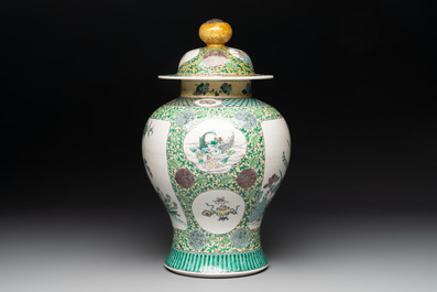 A pair of Chinese verte-biscuit 'cranes and flowers' vases and covers, 19th C.