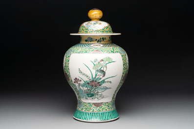 A pair of Chinese verte-biscuit 'cranes and flowers' vases and covers, 19th C.